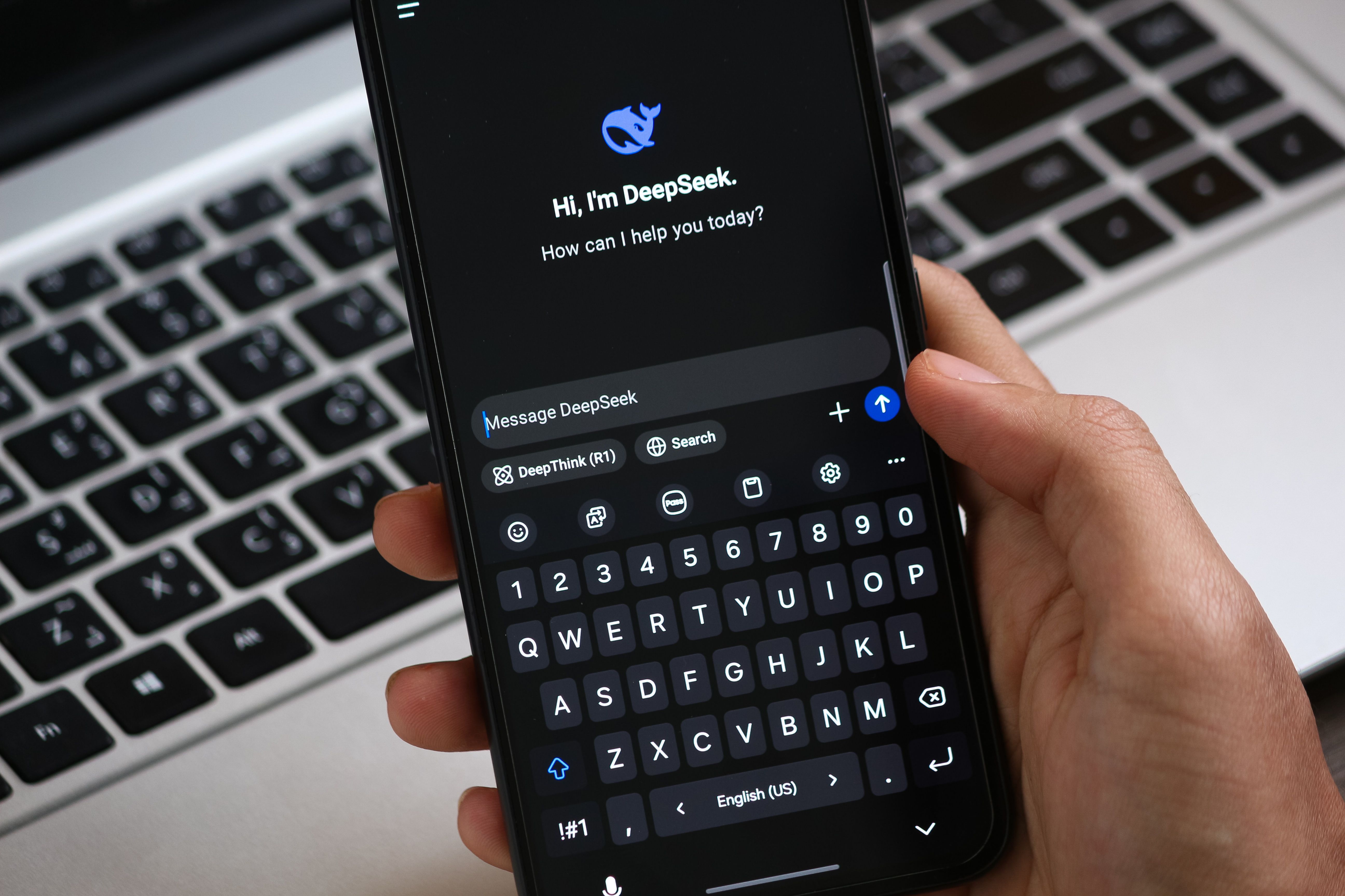 Smartphone showing an AI chat interface, illustrating AI search and AI overviews